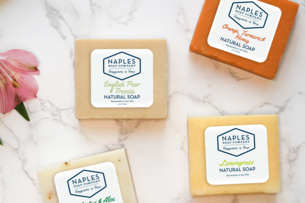 Four bars of of soap on a marble counter top